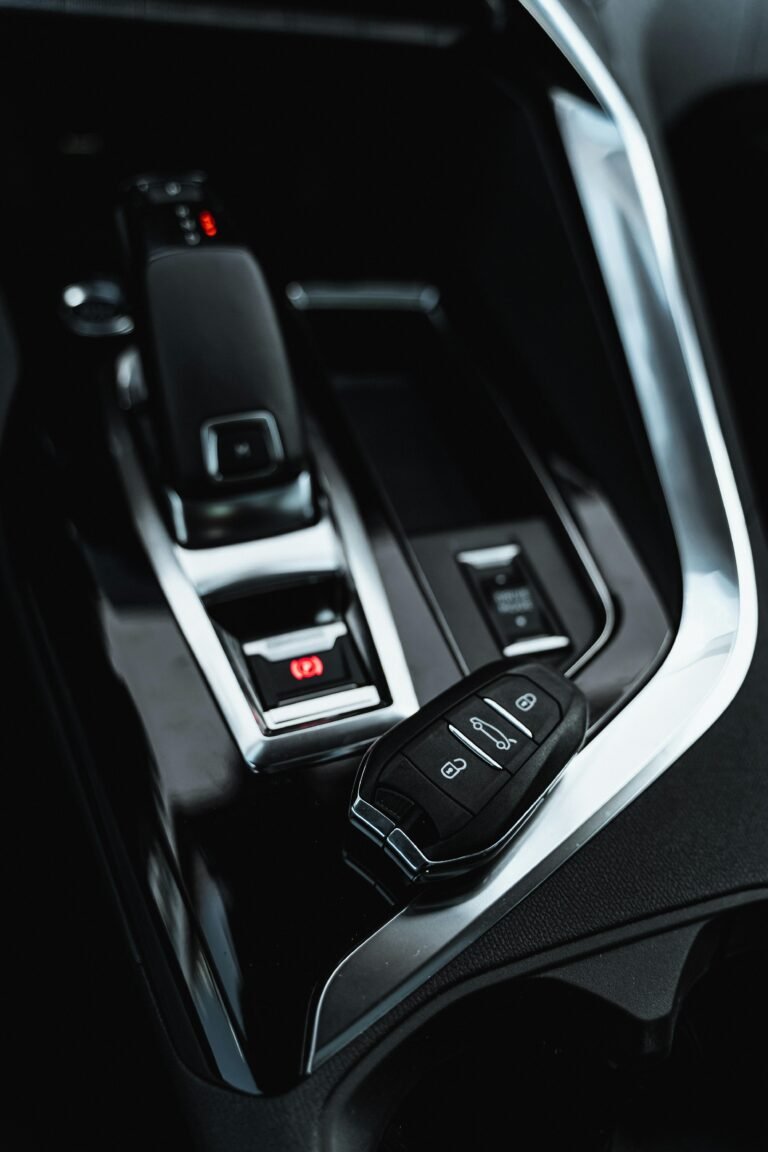 Close-up of a car's modern interior showing the shifter and key fob.